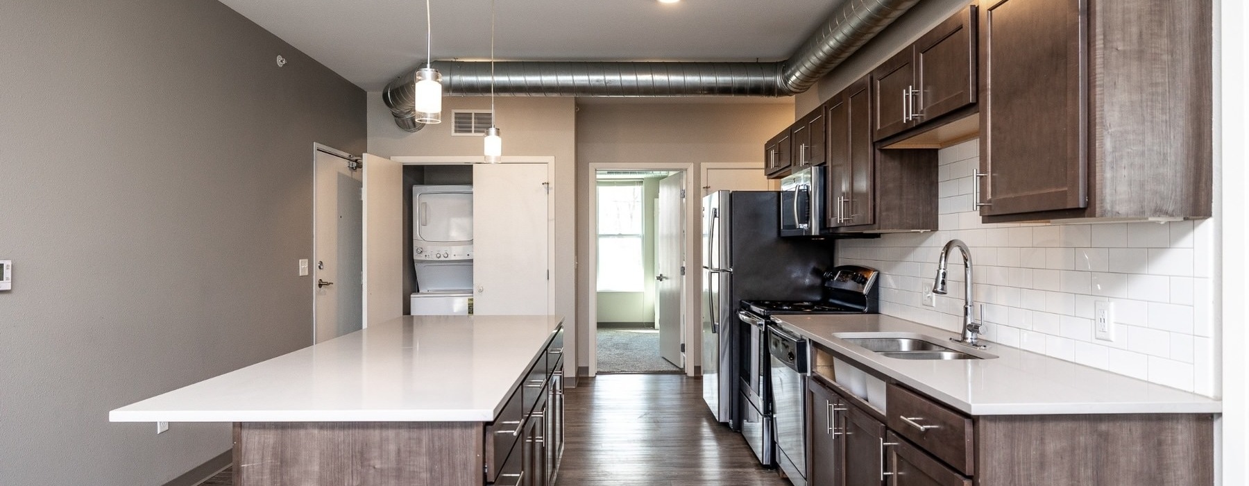 a kitchen with wooden cabinets