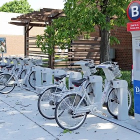 a row of bicycles for rent